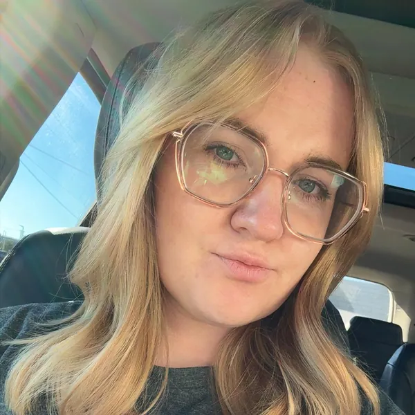 Taylor Jewell, Bestie Squad member, in glasses